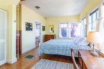 Queen bedroom with water views, original artwork, and a nice hodge podge of antique furnishings 